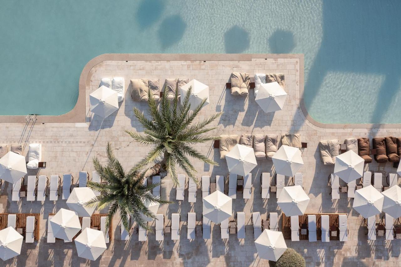 Helea Lifestyle Beach Resort Kallithéa Esterno foto Aerial view of the pool at the Westin Dubai