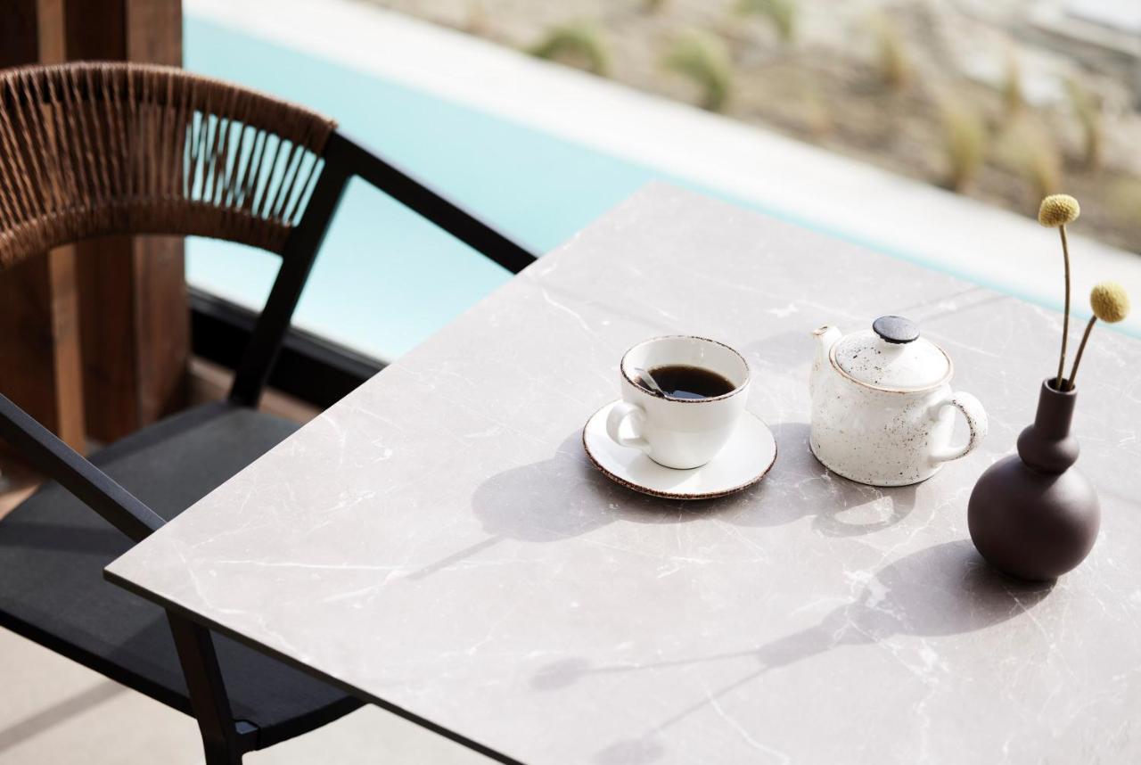 Helea Lifestyle Beach Resort Kallithéa Esterno foto A table with a porcelain tabletop