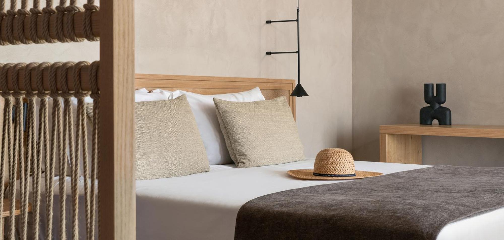 Helea Lifestyle Beach Resort Kallithéa Esterno foto A bed with a straw hat